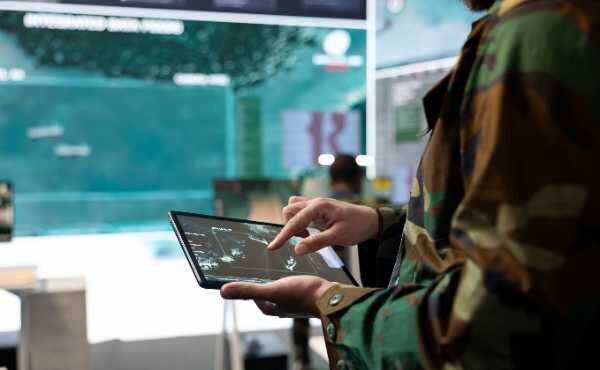 army-recruit-examines-satellite-reconnaissance-system-world-map