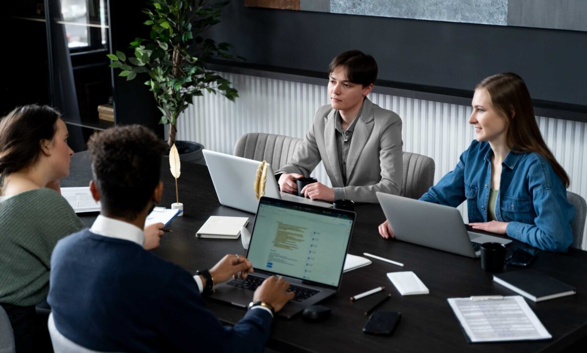 trans-person-working-office-with-colleagues